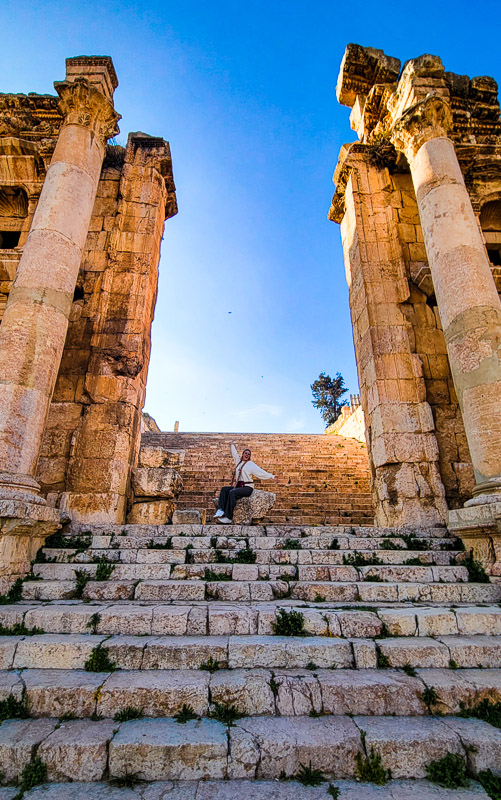caz sitting on steps of temple in jerash